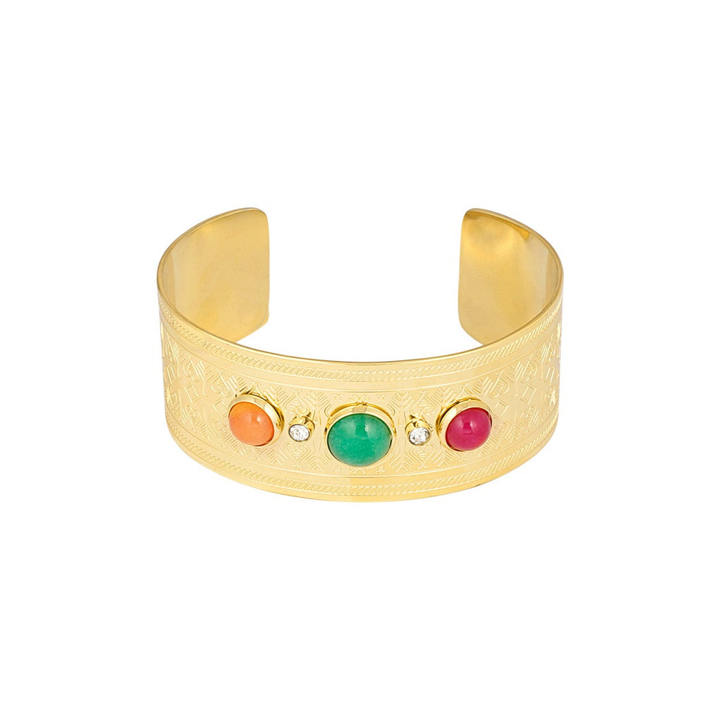A wide gold cuff bracelet featuring five colorful round cabochon stones set across the front, displayed on a clean white background.