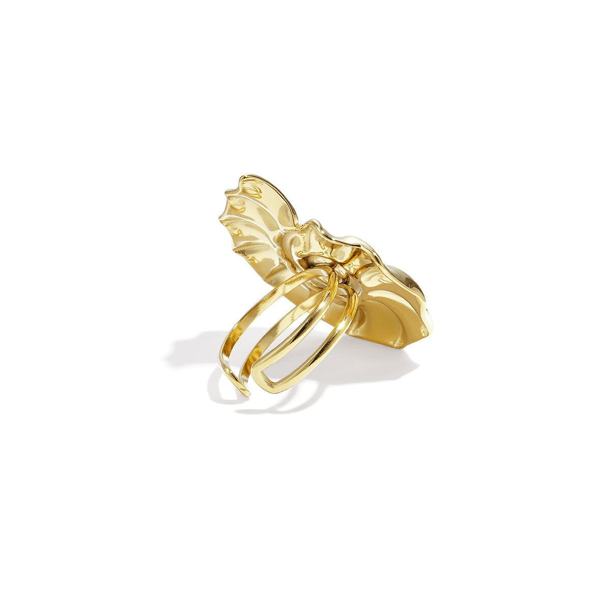 Gold ring with a unique design on a white background