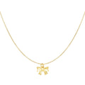 A delicate gold chain necklace featuring a small bow-shaped pendant, displayed against a solid white background.
